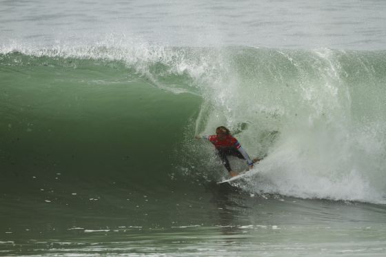 Owen Wright in the tube backside at Supertubos Portugal during the Rip Curl Pro Search before suffering a perforated eardrum after a horrendous wipeout on a draining righthander in the Quarterfinals Image Rip Curl / Warbrick